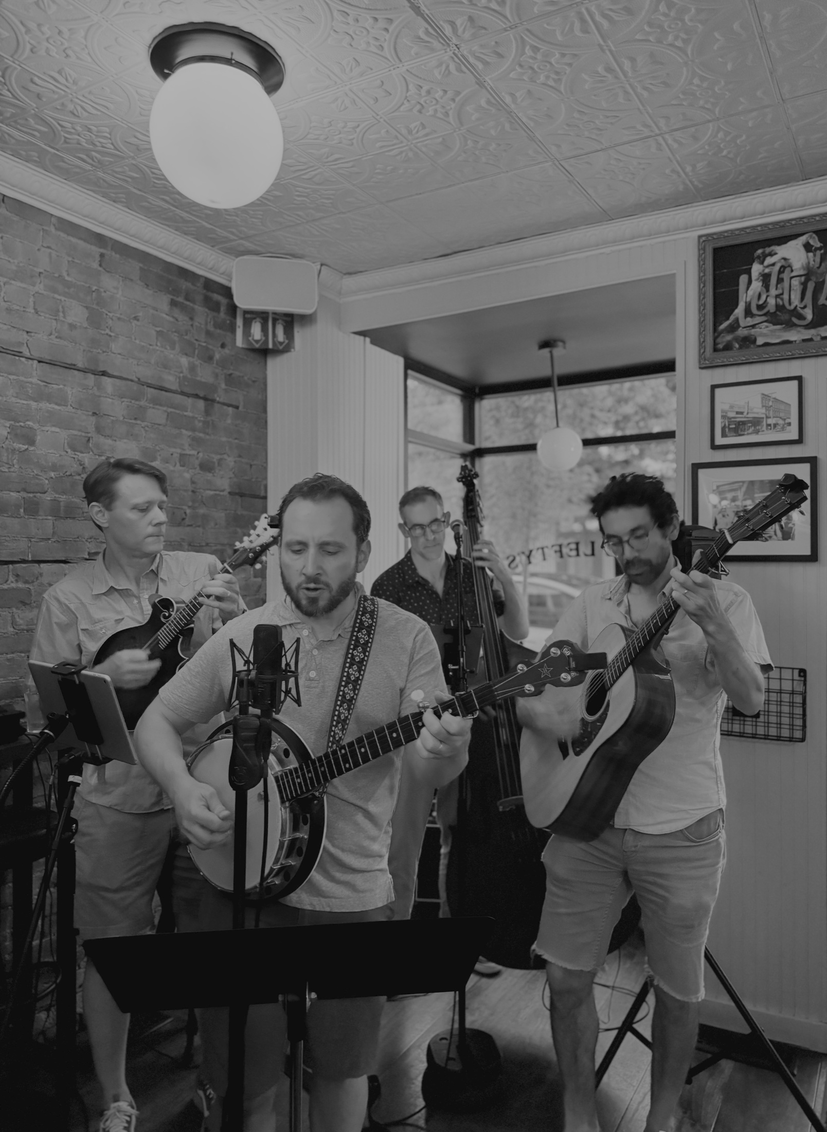 Hudson Line String Band performing with mandolin, banjo, upright bass, and guitar